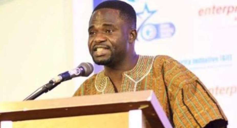 A picture of Ghanaian journalist Manasseh Azure Awuni speaking at an event.